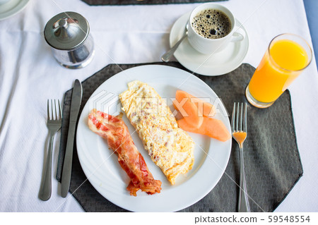 Healthy tasty breakfast on table in outdoor cafe Healthy tasty breakfast on table in outdoor cafe 59548554