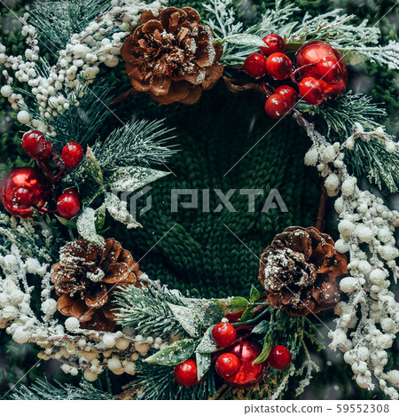 Pine wreath and Christmas decor on a green knitted background 59552308