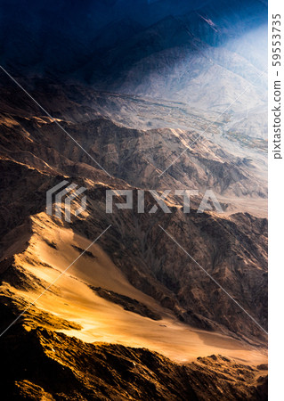 Aerial view of Snow Mountain and light of sunrise on the top himalaya mountains from the plane Aerial view of Snow Mountain and light of sunrise on the top himalaya mountains from the plane 59553735