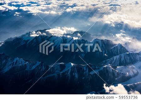 Aerial view of Snow Mountain and light of sunrise on the top himalaya mountains from the plane Aerial view of Snow Mountain and light of sunrise on the top himalaya mountains from the plane 59553736