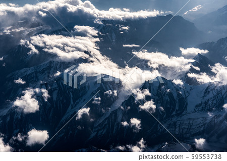 Aerial view of Snow Mountain and light of sunrise on the top himalaya mountains from the plane Aerial view of Snow Mountain and light of sunrise on the top himalaya mountains from the plane 59553738
