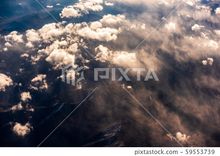 Aerial view of Snow Mountain and light of sunrise on the top himalaya mountains from the plane Aerial view of Snow Mountain and light of sunrise on the top himalaya mountains from the plane 59553739