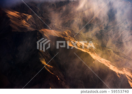 Aerial view of Snow Mountain and light of sunrise on the top himalaya mountains from the plane Aerial view of Snow Mountain and light of sunrise on the top himalaya mountains from the plane 59553740