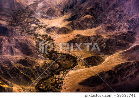 Aerial view of Snow Mountain and light of sunrise on the top himalaya mountains from the plane Aerial view of Snow Mountain and light of sunrise on the top himalaya mountains from the plane 59553741