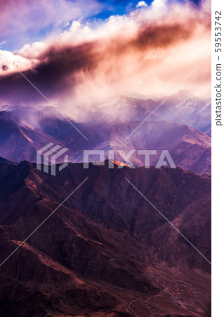 Aerial view of Snow Mountain and light of sunrise on the top himalaya mountains from the plane Aerial view of Snow Mountain and light of sunrise on the top himalaya mountains from the plane 59553742