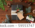 Natural design packaging Christmas gift wrapping and red manicure female hands 59553747