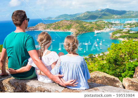 Adorable little kids and young father enjoying the view of picturesque English Harbour at Antigua in Adorable little kids and young father enjoying the view of picturesque English Harbour at Antigua in 59553984