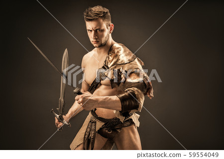 Portrait of angry warrior in leather clothes with swords Portrait of angry warrior in leather clothes with swords 59554049