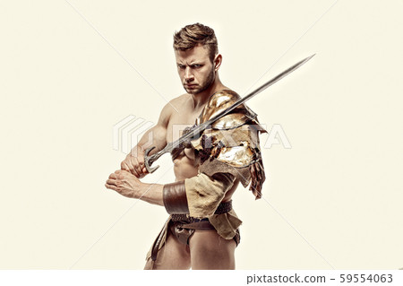 Muscular warrior with sword against of white background Muscular warrior with sword against of white background 59554063