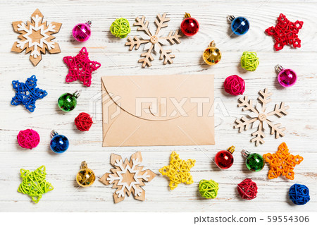 Top view of envelope on festive wooden background. Top view of envelope on festive wooden background. 59554306