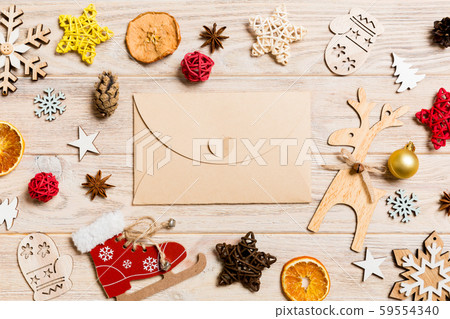Top view of envelope on festive wooden background. Top view of envelope on festive wooden background. 59554340