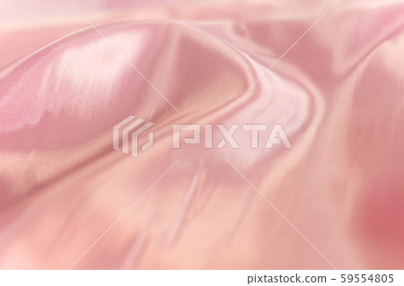 Soft focus of pink colored silk material background texture. Soft focus of pink colored silk material background texture. 59554805