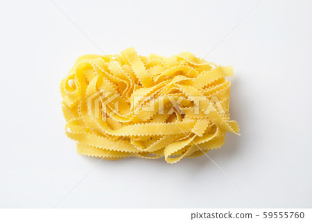 Tasty pasta shape reginelle on white. Isolated. board with flour. View from above. 59555760