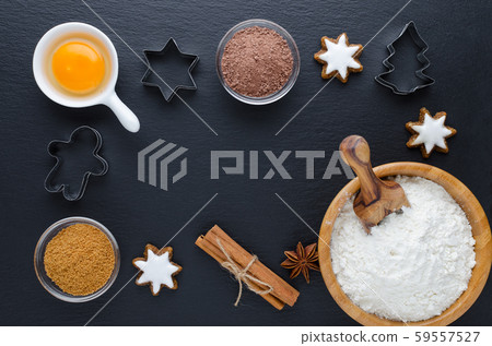 ingredients and kitchen tools on black background, flat lay 59557527