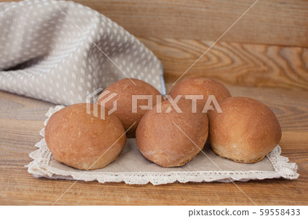 Fresh mouth-watering buns. Several delicious round buns 59558433