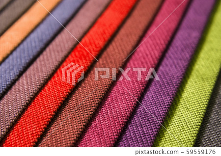 Colorful and bright fabric samples of furniture and clothing upholstery. Close-up of a palette of 59559176