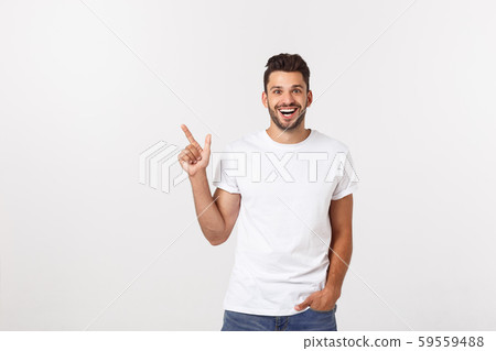 Man pointing showing copy space isolated on white background. Casual handsome Caucasian young man. Man pointing showing copy space isolated on white background. Casual handsome Caucasian young man. 59559488