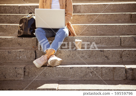 Young freelancer working in the city centre 59559796