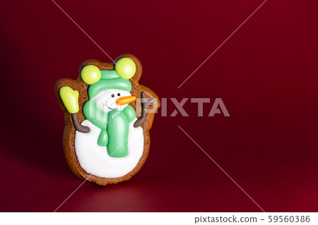 gingerbread cookie of cute snowman on red gingerbread cookie of cute snowman on red 59560386