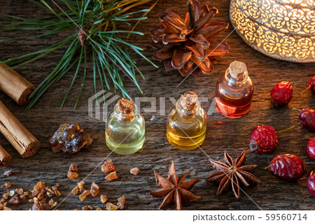 Christmas mix of essential oils with frankincense, myrrh, cinnamon, star anise and dried rose hips Christmas mix of essential oils with frankincense, myrrh, cinnamon, star anise and dried rose hips 59560714