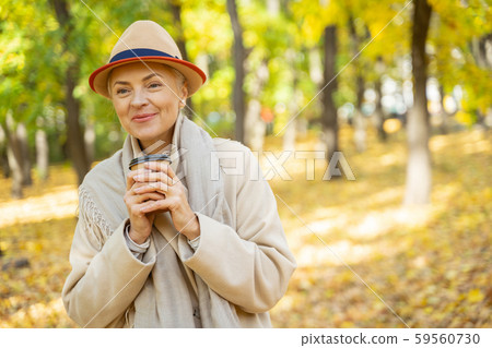 Pretty female with a cup of coffee Pretty female with a cup of coffee 59560730