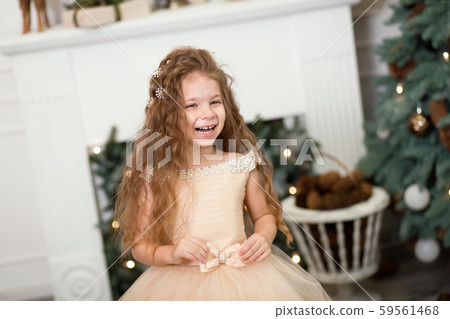 portrait of cute laughting little girl in a lush portrait of cute laughting little girl in a lush 59561468