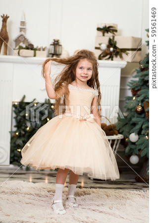 Little cute girl princess in a chic dress laughs Little cute girl princess in a chic dress laughs 59561469