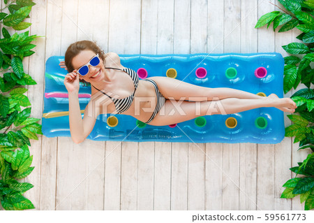 Young woman top view summer rest concept 59561773