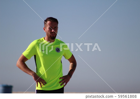 Upper body of a foreign professional soccer player standing on the beach Upper body of a foreign professional soccer player standing on the beach 59561808