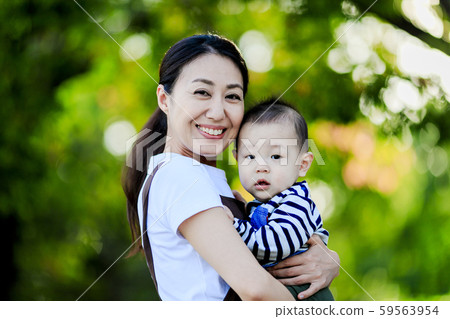 A woman with a baby A woman with a baby 59563954