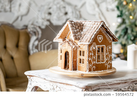 Gingerbread house, concept holiday of Christmas and Happy new year. Defocused lights of Christmas 59564572