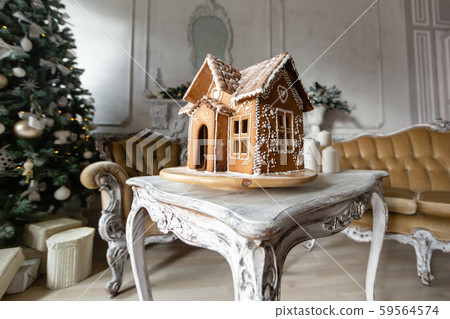 Gingerbread house, concept holiday of Christmas and Happy new year. Defocused lights of Christmas Gingerbread house, concept holiday of Christmas and Happy new year. Defocused lights of Christmas 59564574
