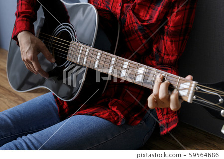 Hand of woman playing guitar Hand of woman playing guitar 59564686