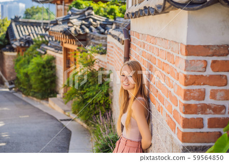 Young woman tourist in Bukchon Hanok Village is one of the famous place for Korean traditional 59564850