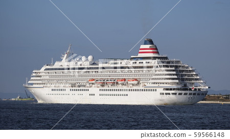 A luxury cruise ship Asuka Ⅱ leaving Osaka Port in the morning sun 59566148