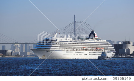 A luxury cruise ship Asuka Ⅱ leaving Osaka Port in the morning sun 59566149