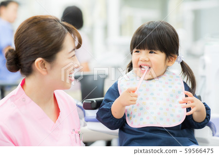Dental hygienist and child Dental hygienist and child 59566475