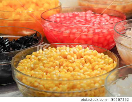 Sweet tropical corn with syrup in glass bowl Sweet tropical corn with syrup in glass bowl 59567362