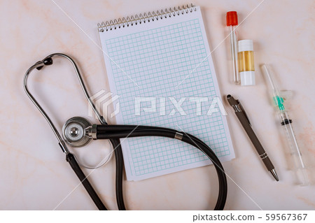 Phonendoscope and paper tablet on marble 59567367