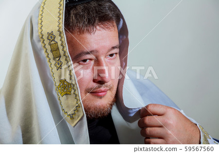 Orthodox Jew wrapped with traditional religious 59567560