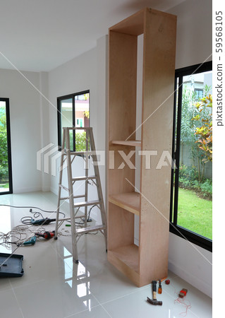 interior home office renovation, furniture built in with plywood material installing in a new house 59568105
