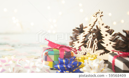 Christmas background: Origami presents and pine cones and Christmas tree ornaments Christmas background: Origami presents and pine cones and Christmas tree ornaments 59568409