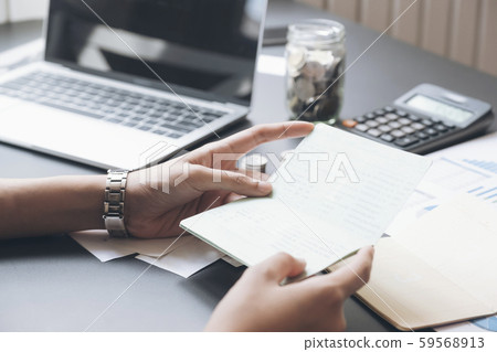 Accountant hands holding saving account passbook, Accountant hands holding saving account passbook, 59568913