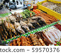 Freshly made marine products, seafood, fish and meat on the shelves of a street vendor kiosk, Phuket, Thailand 59570376