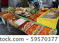 Freshly made marine products, seafood, fish and meat on the shelves of a street vendor kiosk, Phuket, Thailand 59570377
