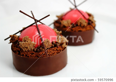 Strawberry and brownie dessert with dark chocolate jelly caviar on chocolate border Strawberry and brownie dessert with dark chocolate jelly caviar on chocolate border 59570996
