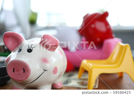 Funny piggy going away from couple pigs 59580425