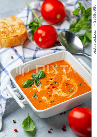 Spicy tomato soup with green basil. Spicy tomato soup with green basil. 59580986