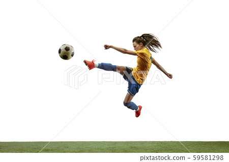 Female soccer player kicking ball at the stadium 59581298