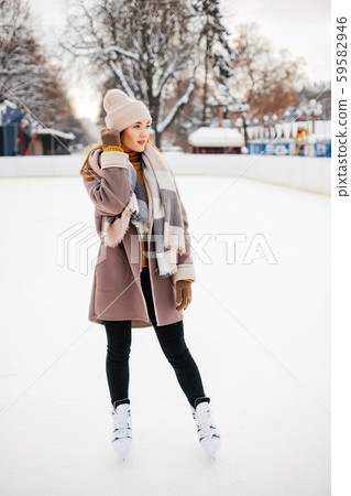 Cute and beautiful girl in a winter city Cute and beautiful girl in a winter city 59582946